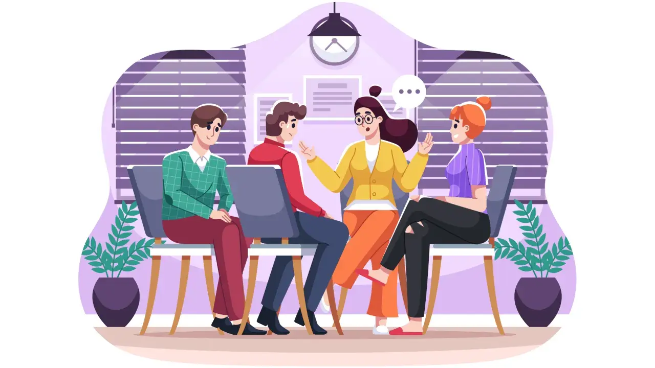 Persone sedute in cerchio, in un ambiente che evoca il lavorare nel sociale, discutono animatamente.